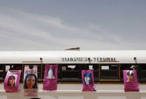 If you went missing: Pictures of the missing on the side of a bus. Picture courtesy of Reuters.