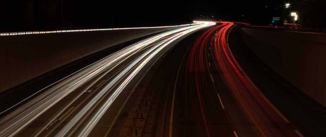 Curve of light around lonely highway