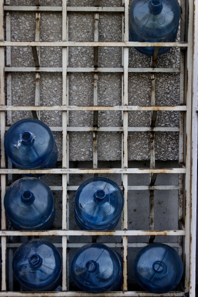 Empty jugs for water in a grib