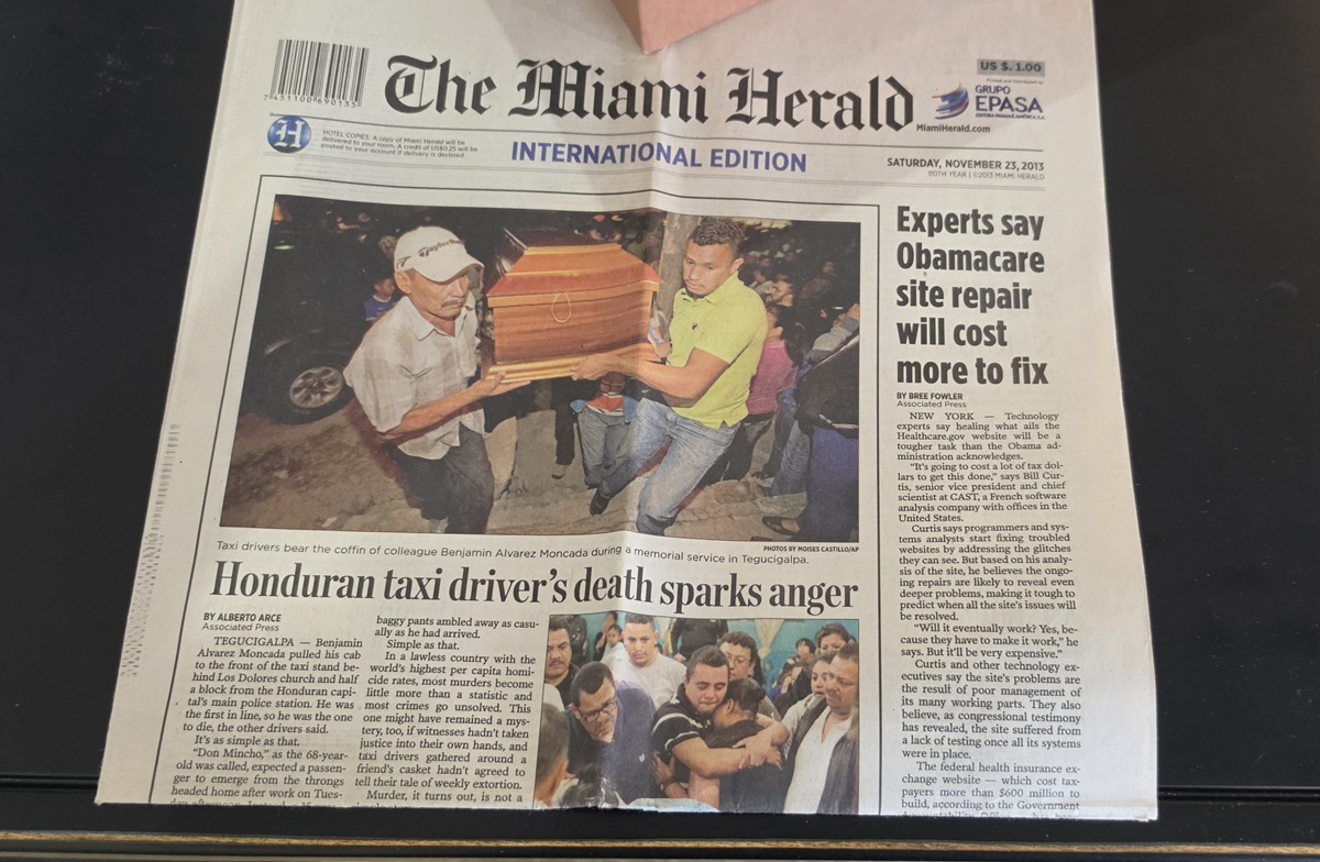 Front page of the Miami Herald showing funeral for taxi driver in 2013
