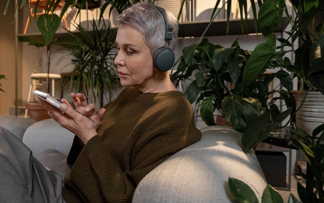 Woman listening to audiobook by cottonbro studio